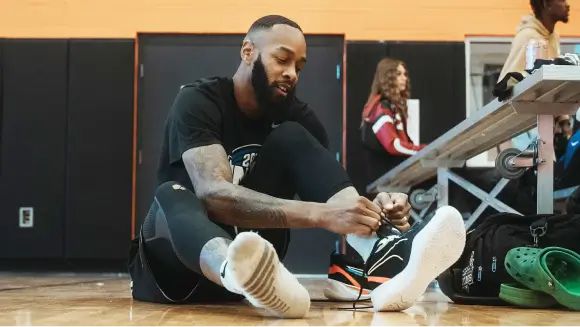 Player tying his shoelaces